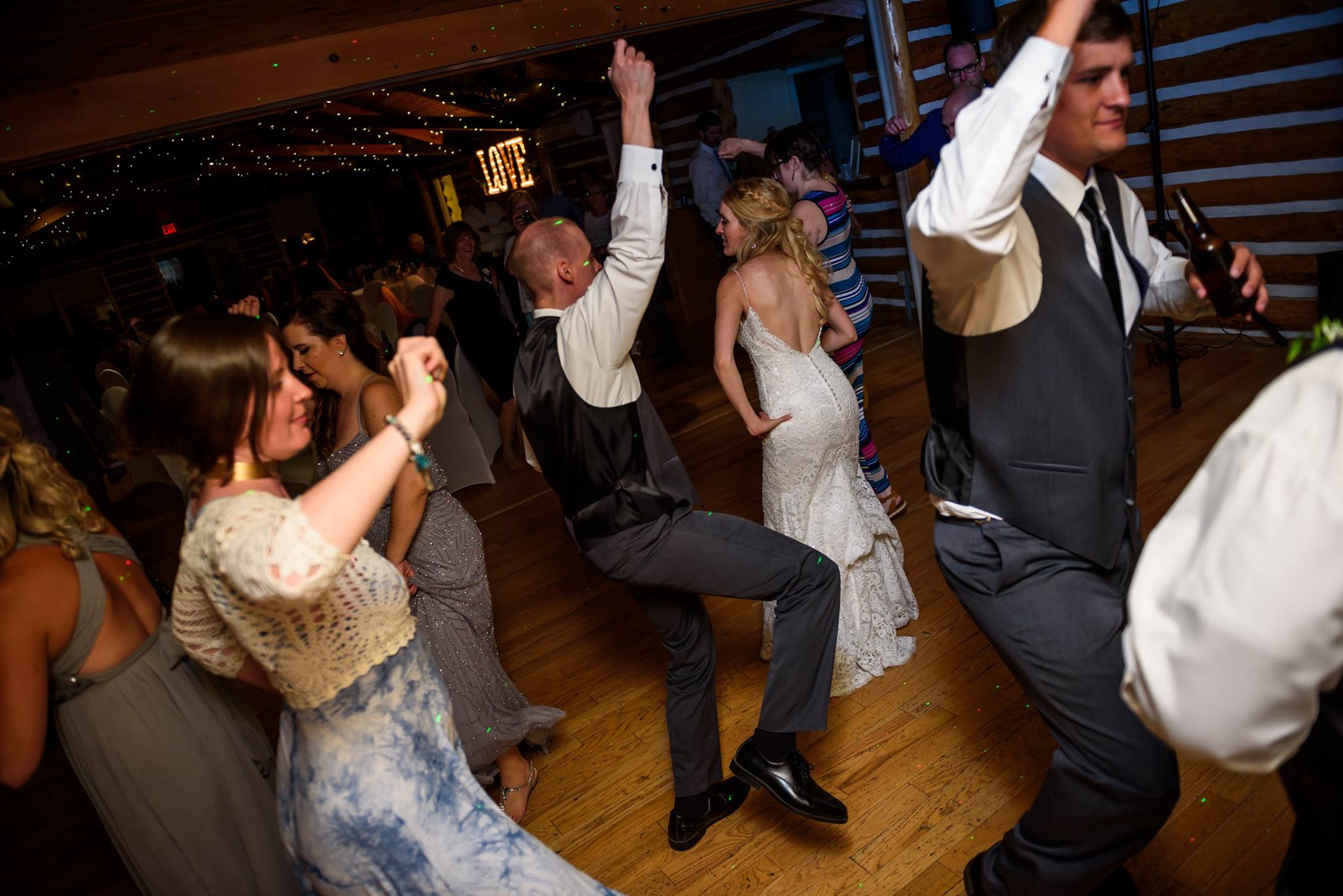 Bride and guests dancing during a wedding reception